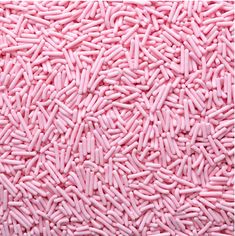 pink sprinkles are scattered on top of each other in this close up photo