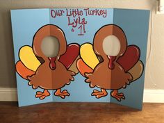 two cardboard turkeys with the words our little turkey lays 1 - 4 on them