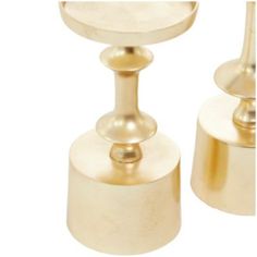 two golden candlesticks on white background