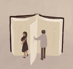 two people standing in front of an open book