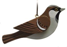 a brown and white bird ornament hanging from a chain