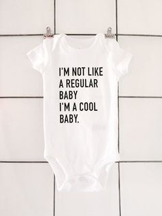 a baby bodysuit that says i'm not like a regular baby, i'm a cool baby