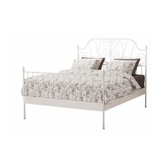 a white metal bed frame with pillows and sheets on it's headboard, in front of a white background