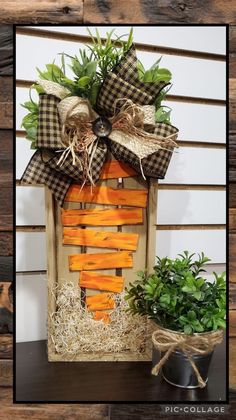 a wooden box with some plants in it