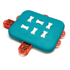 an orange and blue dog toy with four dogs in it's trays on the floor