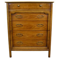 a wooden dresser with four drawers and two handles