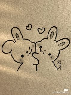 two animals with hearts drawn on the wall