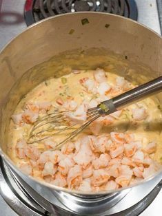 the food is being prepared in the pot on the stove