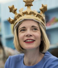 a woman wearing a gold crown on her head