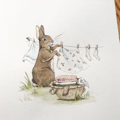 a drawing of a rabbit hanging clothes on a line and looking at something in a basket