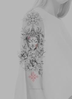 a woman's arm with flowers on it and a buddha face tattooed to the side