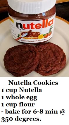 there is a jar of nutella and two cookies on the plate