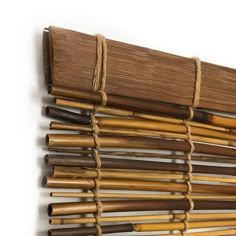 a wall hanging made out of bamboo sticks