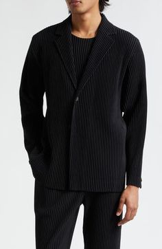 The Japanese label takes a forward-thinking approach to this single-breasted blazer expertly designed with Issey Miyake's signature wrinkle-resistant pleats 29" length (size 2) Front button closure Notched lapels One-button cuffs Unlined 100% polyester Dry clean or machine wash, line dry Imported Designer Clothing Asian Owned/Founded Structured Black Blazer For Business, Structured Black Blazer For Work, Spring Business Blazer With Structured Fit, Structured Black Business Blazer, Structured Long Sleeve Business Blazer, Modern Black Office Wear Blazer, Modern Black Single Breasted Blazer, Black Structured Outerwear For Business, Modern Structured Blazer With Lapel Collar