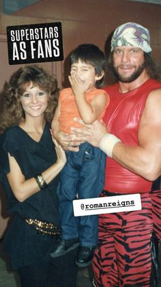 a man and woman posing for a photo with a child