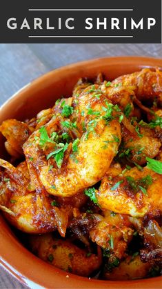 a bowl filled with cooked shrimp and garnished with parsley on the side