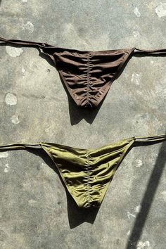 The Brown and Green Bikini combines earthy tones with a pop of vibrant color, offering a perfect balance of understated elegance and bold style. The nude base creates a flattering, natural look, while the green accents add a fresh, tropical touch. Whether you're relaxing by the pool or enjoying a beach getaway, this bikini provides a chic and comfortable fit for any summer occasion.  Pair it with a woven beach hat, gold jewelry, and a flowing cover-up for a laid-back yet stylish look, or keep it simple with flip-flops and a beach tote for effortless beach vibes. Brown Swimsuit Aesthetic, Brown Two Piece, Swimwear Aesthetic, Aesthetic Brown, Swimsuits For Women, Love And Co, Soak Up The Sun, Clover Necklace