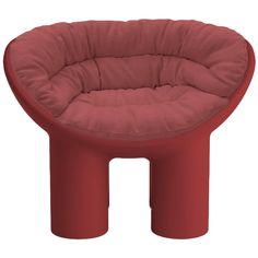 a red chair with a round seat on it's legs and an ottoman in the middle