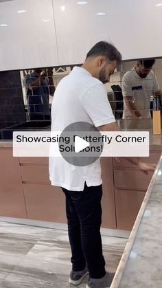 a man standing in front of a kitchen counter with the words showcast utterly corner