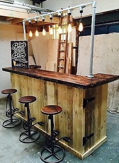 the bar is made out of wood and has four stools