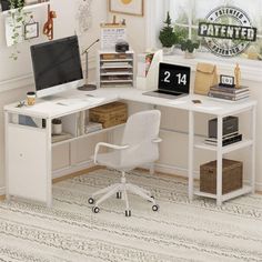 a white desk with a computer on top of it