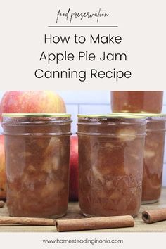 two jars filled with apple pie jam sitting on top of a table