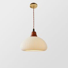 a white and brown light hanging from a ceiling