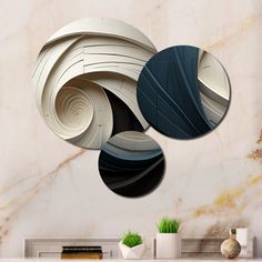 three circular shapes on a marble wall above a fireplace with vases and books in the background