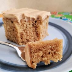 a piece of cake sitting on top of a blue and white plate next to a fork