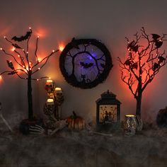 halloween decorations are displayed on a mantle