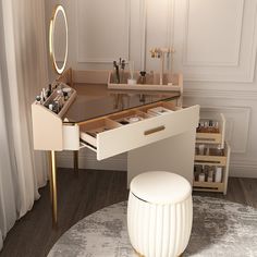 a vanity with a mirror, stool and other items on it in a white room