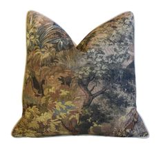 a decorative pillow with an image of trees and flowers on the front, against a white background