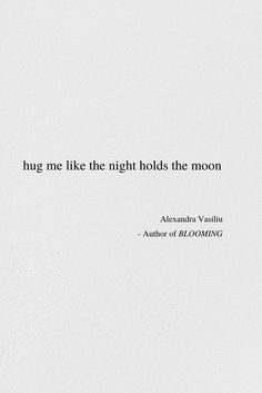 a white wall with a quote on it that says hug me like the night holds the moon