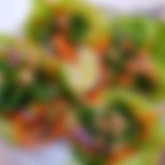 blurry photograph of green and orange flowers