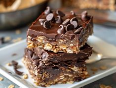 three pieces of chocolate peanut butter granola bars stacked on top of each other