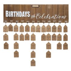 a wooden sign that says birthdays and celebrations with tags hanging from the top of it