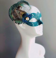 Enchant and captivate with our exquisite women's masquerade mask in teal! This opulent mask perfectly blends the allure of teal elegance with the majestic beauty of peacock feathers, making you the star of every masquerade affair. From grand masquerade balls to soirées and elegant celebrations, our women's masquerade mask is the perfect choice.


Age Group/Gender - Adult/Women's

Size/Type - One size fits all adults

Mask Color - Teal

Mask Material - Plastic

Accent Material - Paint

Special Fe Peacock Mascarade Mask, Turquoise Mask Masquerade Ball, Elegant Fitted Masquerade Mask For Mardi Gras, Masks Feathers, Blue Masquerade Mask, Peacock Mask, Raven Mask, Madi Gras, White Raven