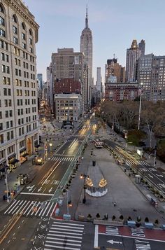 an aerial view of a city street at dusk