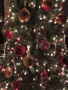 a christmas tree with lights and ornaments on it