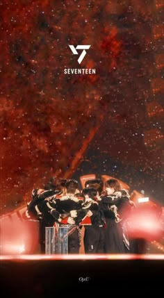 group of people standing together in front of a star filled sky with the words seventeen on it