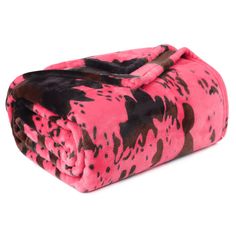 a pink and black animal print blanket on a white background