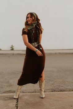 Introducing the Ash Fork Dress - your perfect combination of comfort and style. With a cozy fit and a subtle slit to the knee, this dress will have you looking effortlessly chic. Unleash your inner cowgirl with this old west-inspired piece. Sizing: Small 2-4, Medium 6-8, Large 10-12 Model's Measurements: Height 5'5 | Bust 32 | Waist 26 | Hips 36 | Size S Velvet Dress With Western Boots, Sunday Western Outfits, Western Brown Dress, A Line Western Dresses, Fancy Western Dress, Dress Up Cowgirl Outfits, Modern Western Family Photoshoot, Sophisticated Country Outfits, Winter Outdoor Wedding Guest Dress