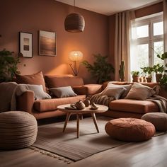 a living room filled with lots of furniture next to a window and potted plants