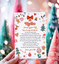 someone is holding up a card with the words hello from your elf