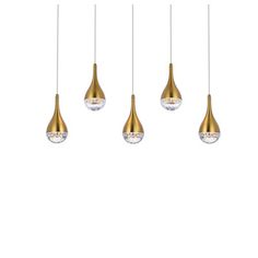 three brass colored pendant lights hanging from the ceiling