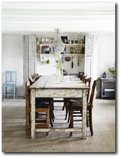 an image of a dining room table and chairs