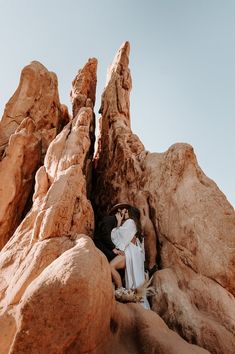 two people sitting on rocks in the desert