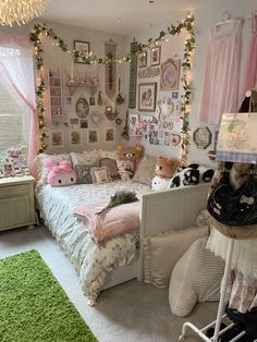 a dog laying on top of a bed in a bedroom next to two stuffed animals