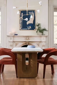 an image of a dining room setting with chairs and a table in the foreground