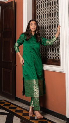 Bring on the festive spirit with our kurta set in pure woven chanderi silk.nWoven Jodhpuri style kurta with matching woven narrow straight pants.nKurta and Pants Fabric : Woven Chanderi Silk.nColour : Dark Green.nModel height is 5.4” and is wearing a size S.nWash Care : Dry Clean Only.nThis product will be exclusively handcrafted for you, making the colour/texture/pattern slightly vary from the image shown, due to multiple artisan-led techniques and processes involved. Designer Kurti Pant Set, Saree Making Ideas From Fabric, Kurta Pant Set Women, Stitching Suits Ideas, Chanderi Silk Blouse Designs, Kurti Pant Set Design, Silk Saree Kurta Design, Indian Kurta Sets For Women, Kurta Set From Saree